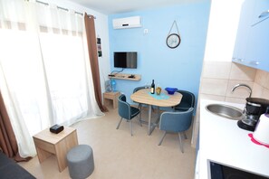 Classic Apartment, Sea View | Living area | LCD TV