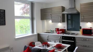 Apartment (Ground Floor) | Private kitchen | Full-size fridge, microwave, oven, stovetop