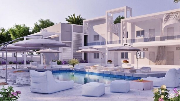 A modern poolside area with lounge chairs, umbrellas, and a swimming pool. - Kellys Plus (Rhodes)