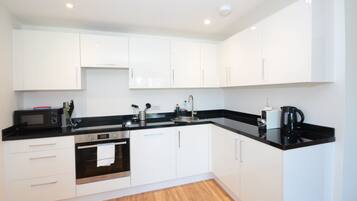 Contemporary Apartment (501) | Private kitchen | Coffee/tea maker, full-sized fridge, microwave, oven