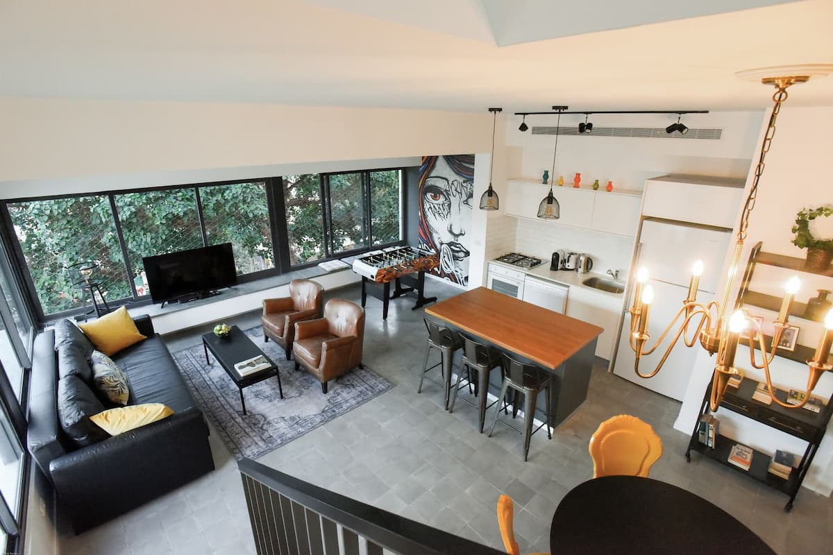 Premium Condo, Multiple Beds, City View | Living area | Flat-screen TV