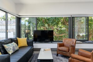 Premium Condo, Multiple Beds, City View | Living area