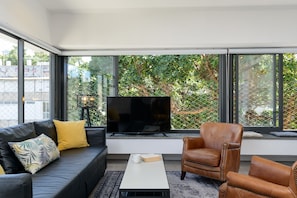 Premium Condo, Multiple Beds, City View | Living area
