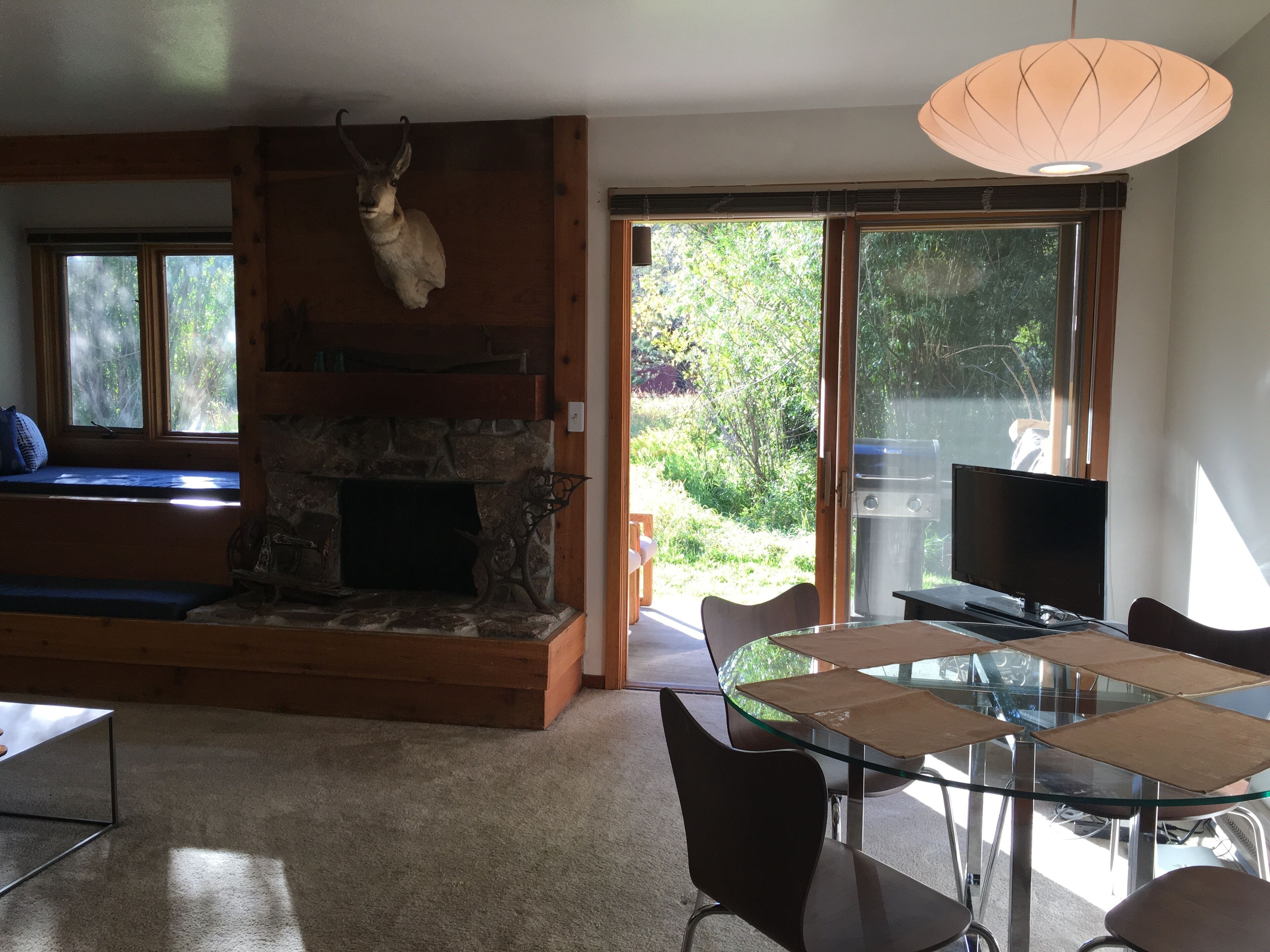 The table near the patio provides a great indoor/outdoor spot for dining/work. 