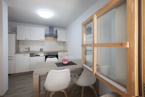 Basic Apartment, Multiple Beds | Living area