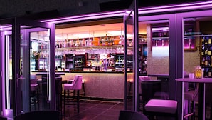 An indoor bar area with seating and a bar counter.