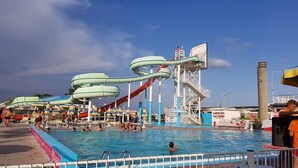 A water park with multiple slides and a pool area.