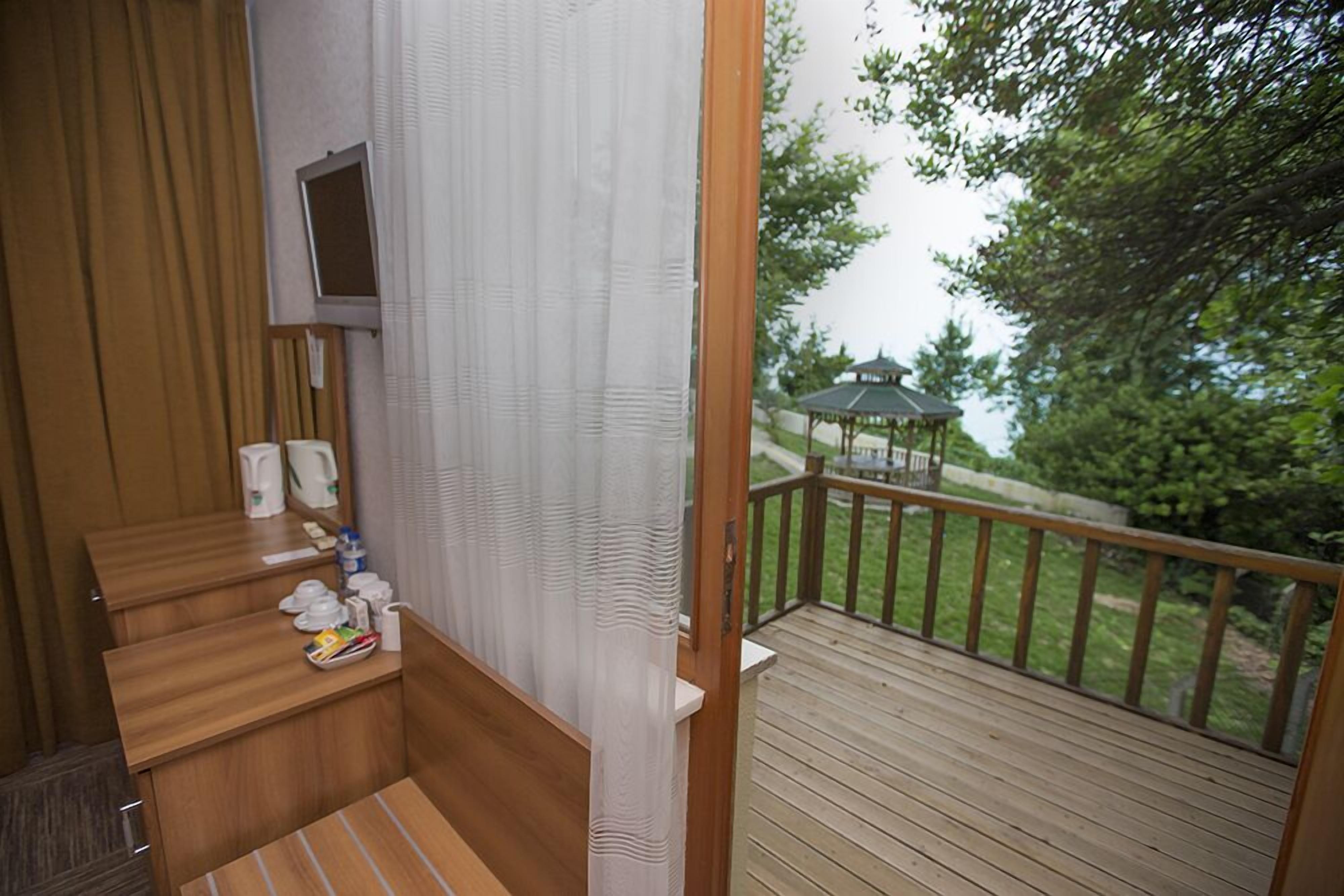 standard double room, non smoking, sea view | living area | 22-inch lcd tv with satellite channels, tv