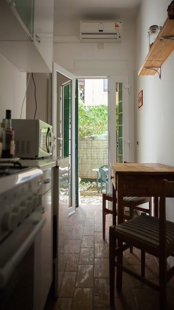 Fridge, microwave, stovetop, coffee/tea maker