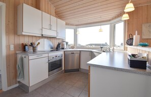 Fridge, stovetop, dishwasher, coffee/tea maker