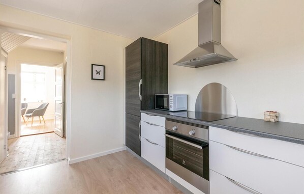 Fridge, stovetop, dishwasher, coffee/tea maker