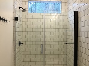 Shower, hair dryer, towels, soap - E Ranch is a modern, creek side, Scandinavian barnhouse. (Scaly Mountain)