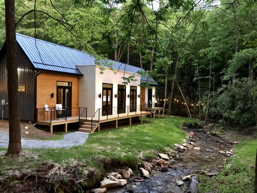 E Ranch is a modern, creek side, Scandinavian barnhouse.