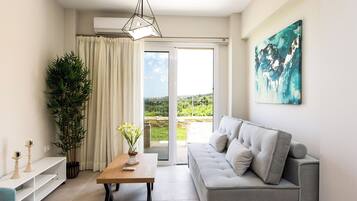 Superior Apartment, 1 Bedroom with Sea View (Ground level) | Living area | Flat-screen TV