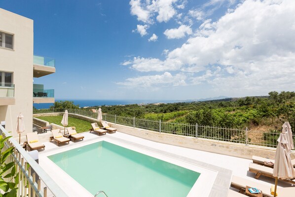 Outdoor pool, pool umbrellas, pool loungers