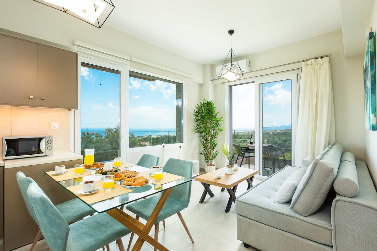 Apartment, 1 Bedroom, Sea View | Living room | Flat-screen TV