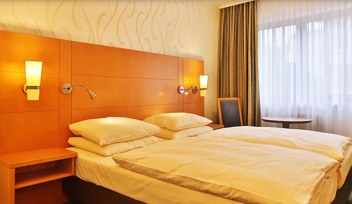 Cortinas blackout, wifi gratis y ropa de cama 