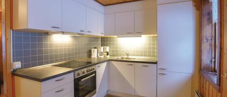 Fridge, stovetop, dishwasher, coffee/tea maker