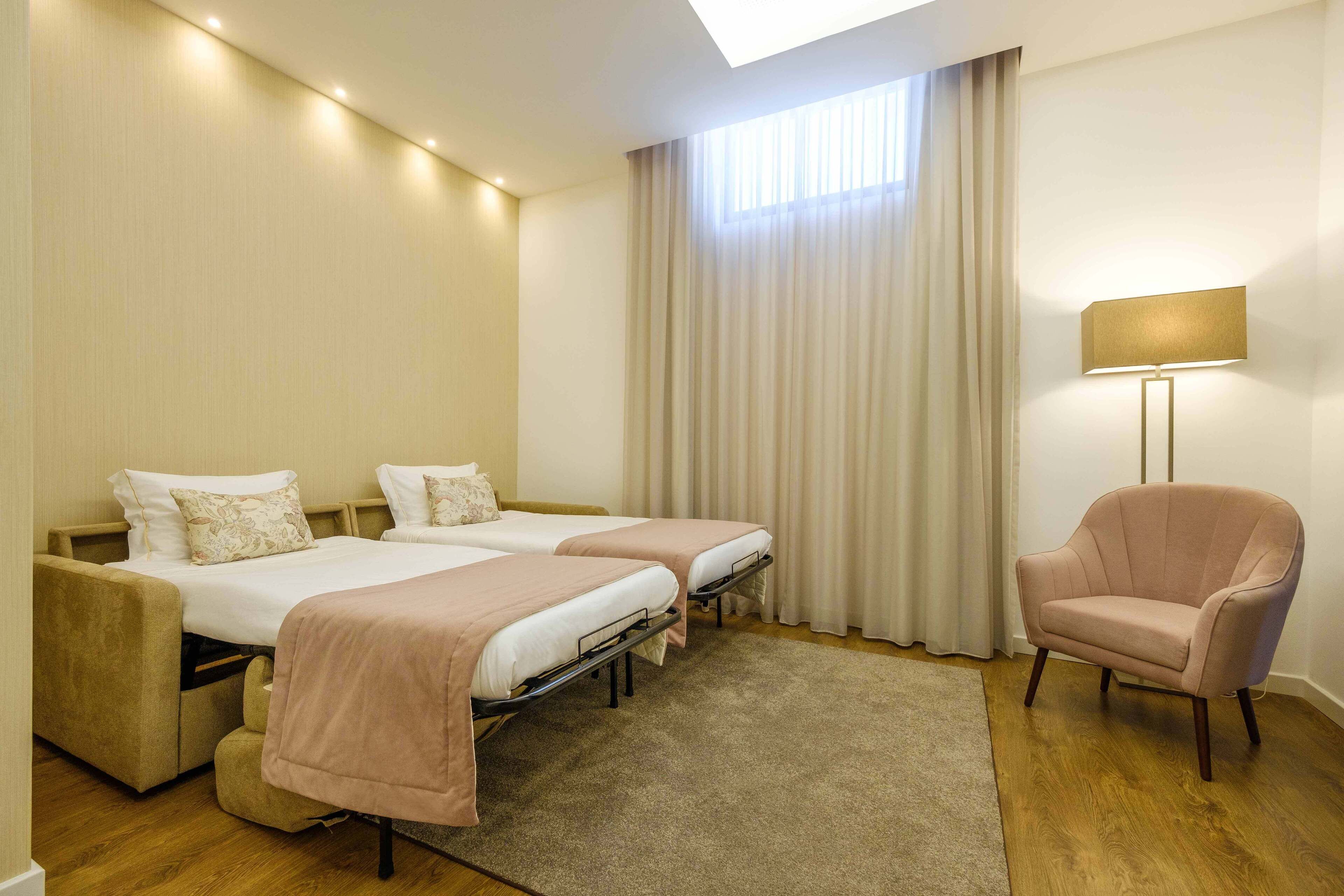 family room | minibar, in-room safe, desk, blackout curtains