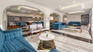 A spacious living area with modern furniture, a kitchen in the background, and a large arched doorway. - SDivine Fátima Hotel (Ourem)