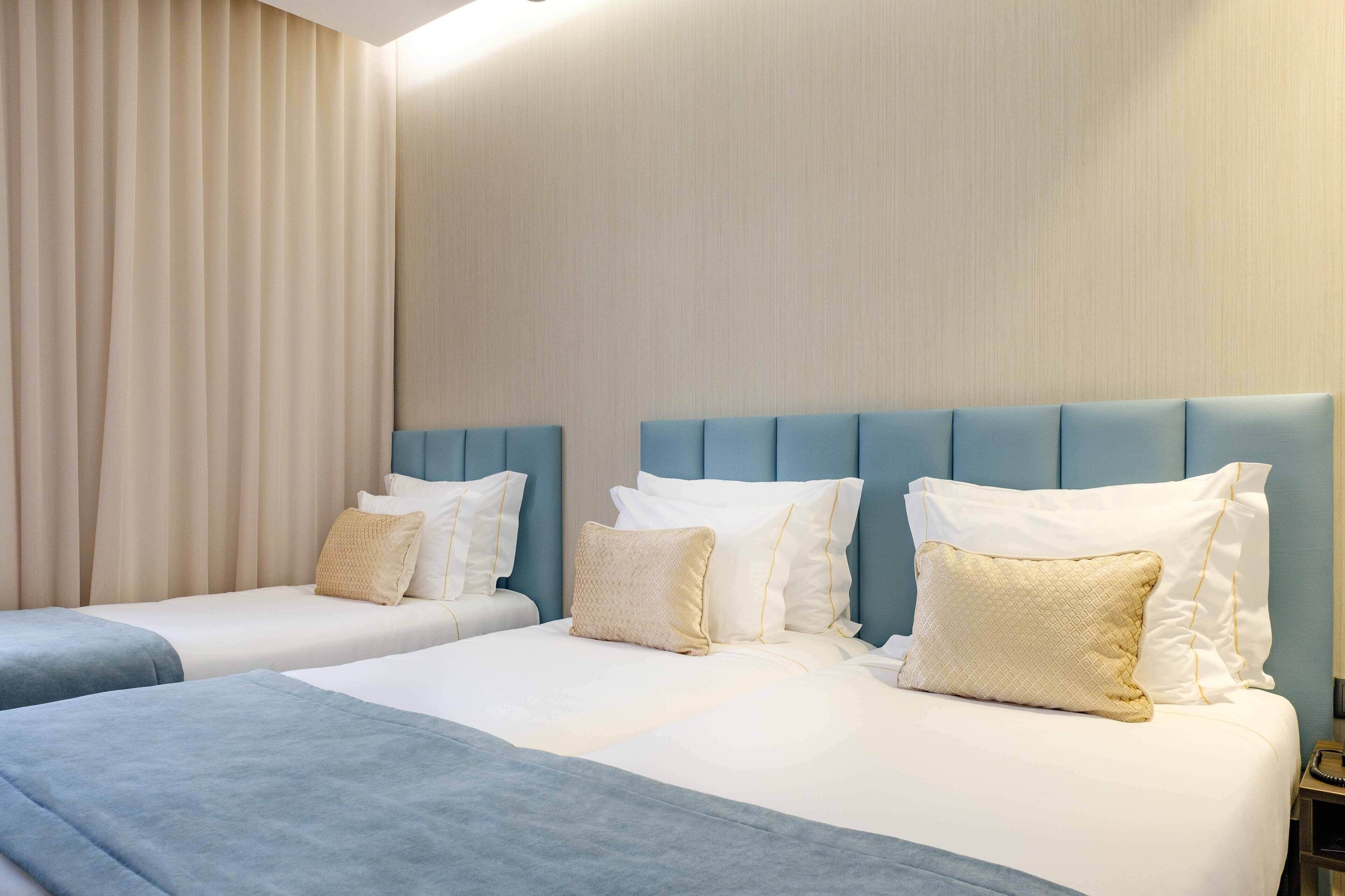 triple room | minibar, in-room safe, desk, blackout curtains