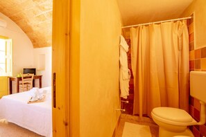Shower, designer toiletries, hair dryer, slippers