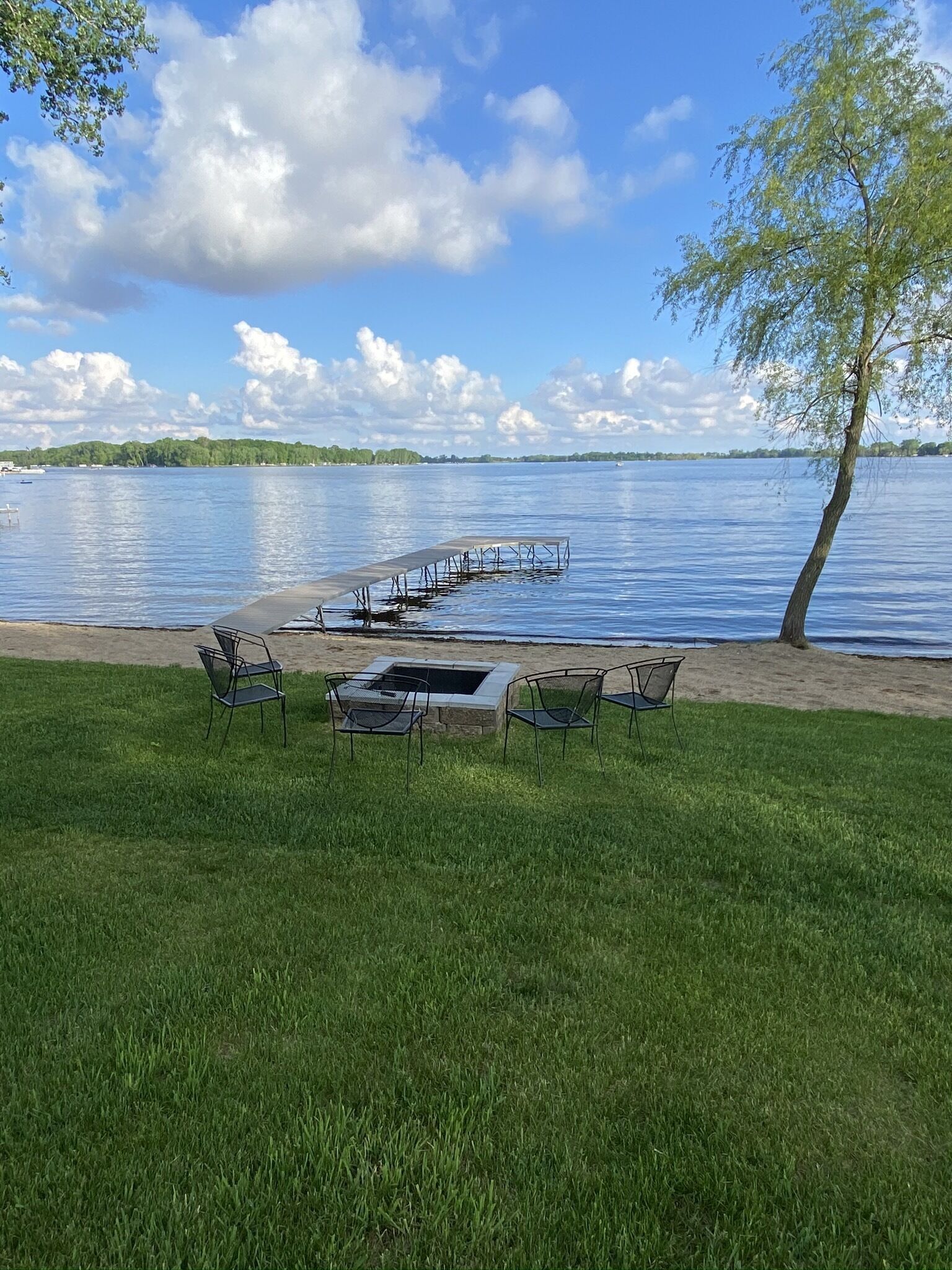 Our beautiful private lakeshore with fire pit-It's such a great place to relax!