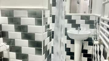 Shower, rainfall showerhead, towels