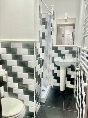 Shower, rainfall showerhead, towels