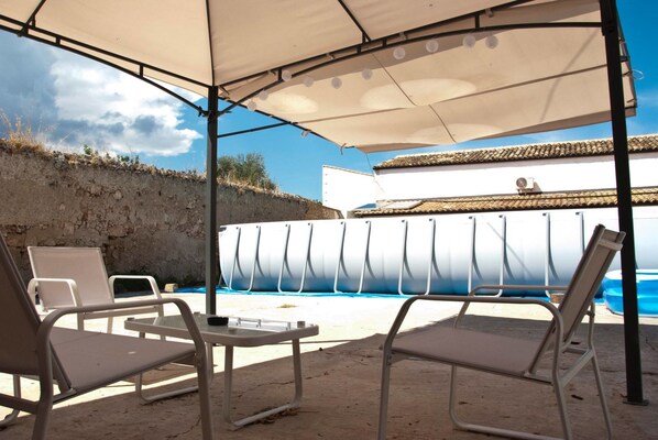 Seasonal outdoor pool, open 10:00 AM to 6:00 PM, sun loungers