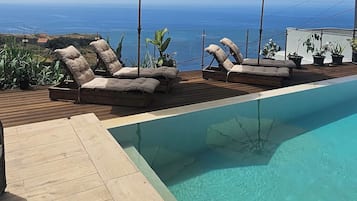 Outdoor pool, open 9:00 AM to 9:00 PM, sun loungers
