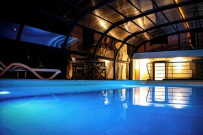 Indoor pool, open 9:00 AM to 8:00 PM, pool umbrellas, pool loungers