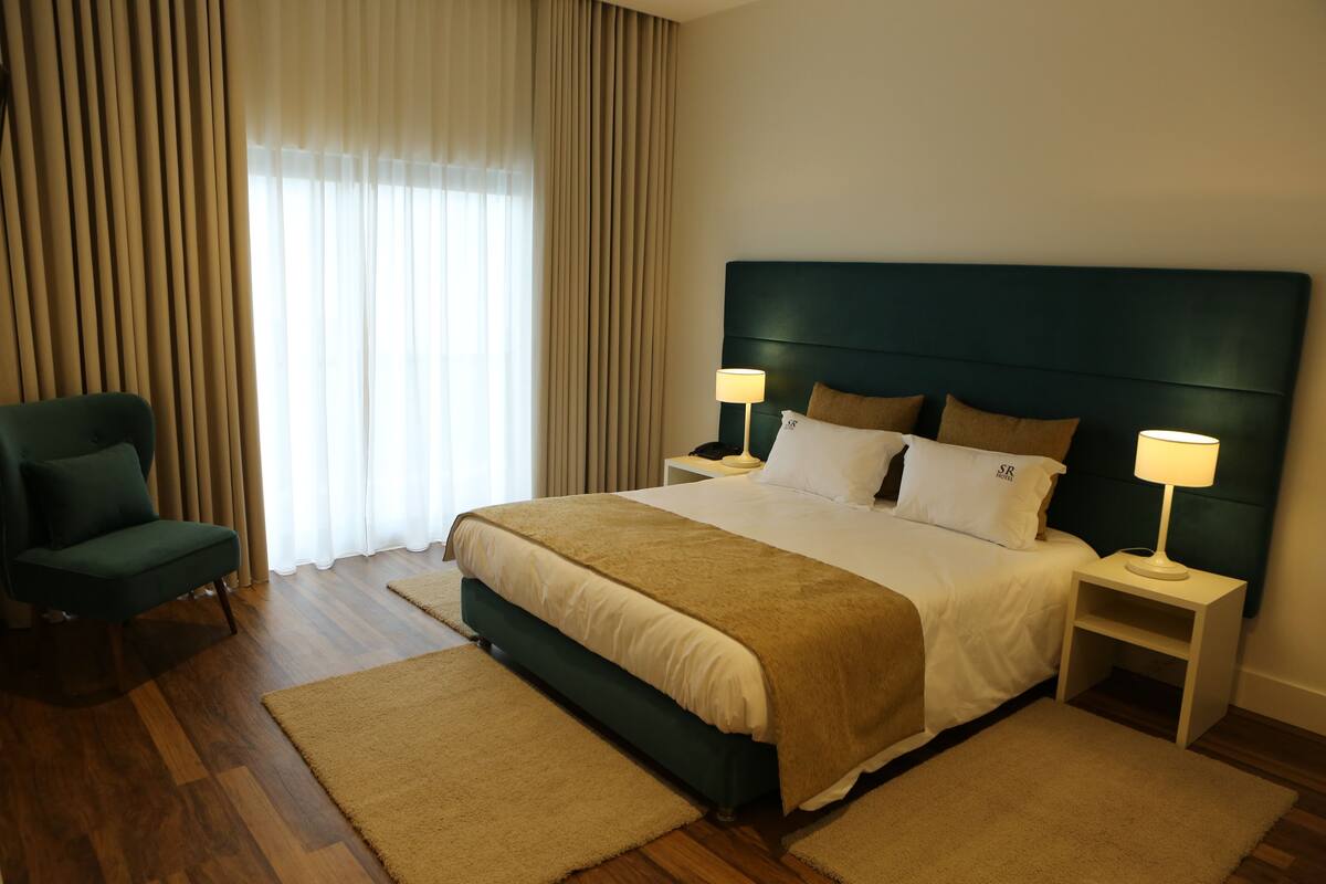 Deluxe Double Room, Balcony | In-room safe, laptop workspace, blackout curtains, soundproofing