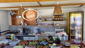 A kitchen area with a variety of food items and kitchen appliances. - Bolero Apart Hotel (Bodrum)