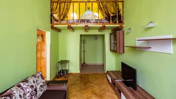 Apartment, 1 Bedroom | Living room | Flat-screen TV