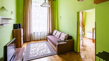 Apartment, 1 Bedroom | Desk, iron/ironing board, free WiFi, bed sheets