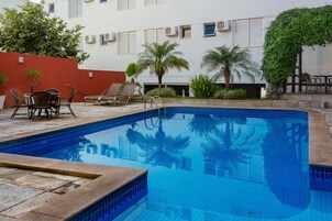 Outdoor pool, open 6:00 AM to 10:00 PM, sun loungers