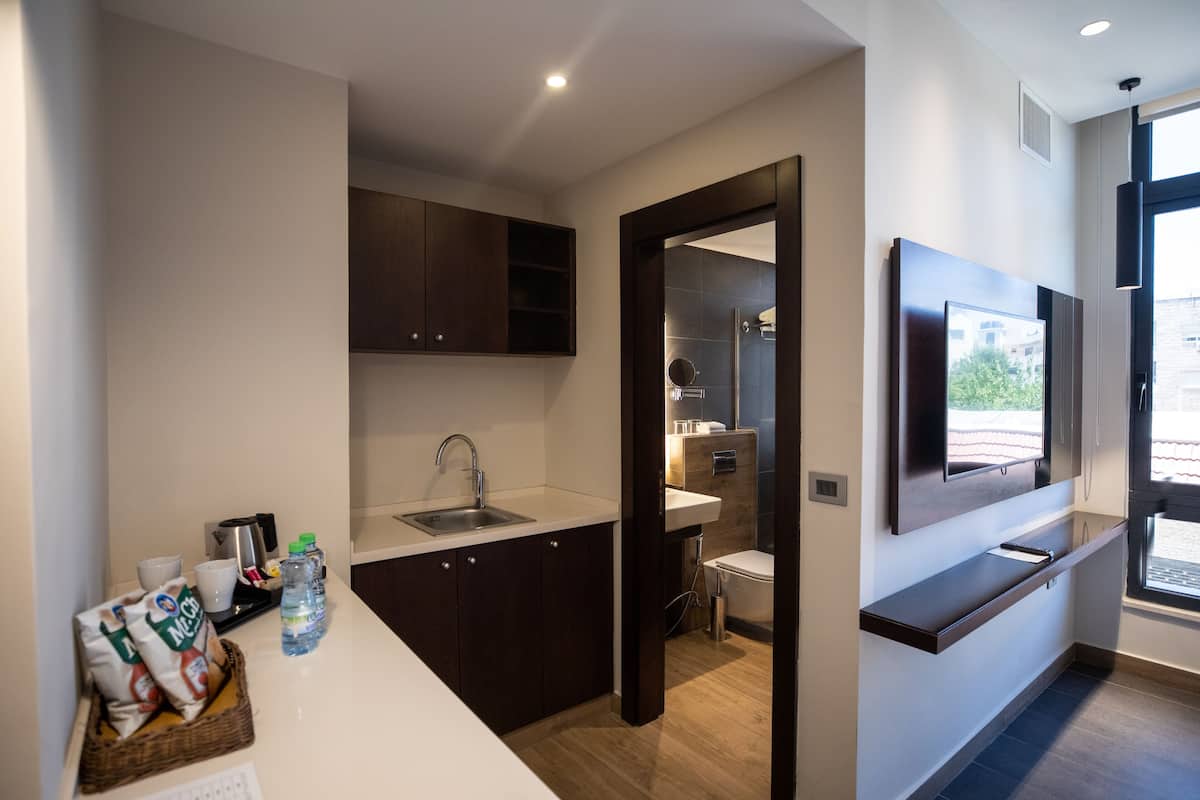 deluxe double room, 1 bedroom, private bathroom | minibar, in-room safe, desk, laptop workspace