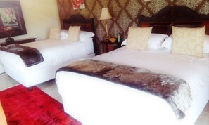 Desk, iron/ironing board, bed sheets