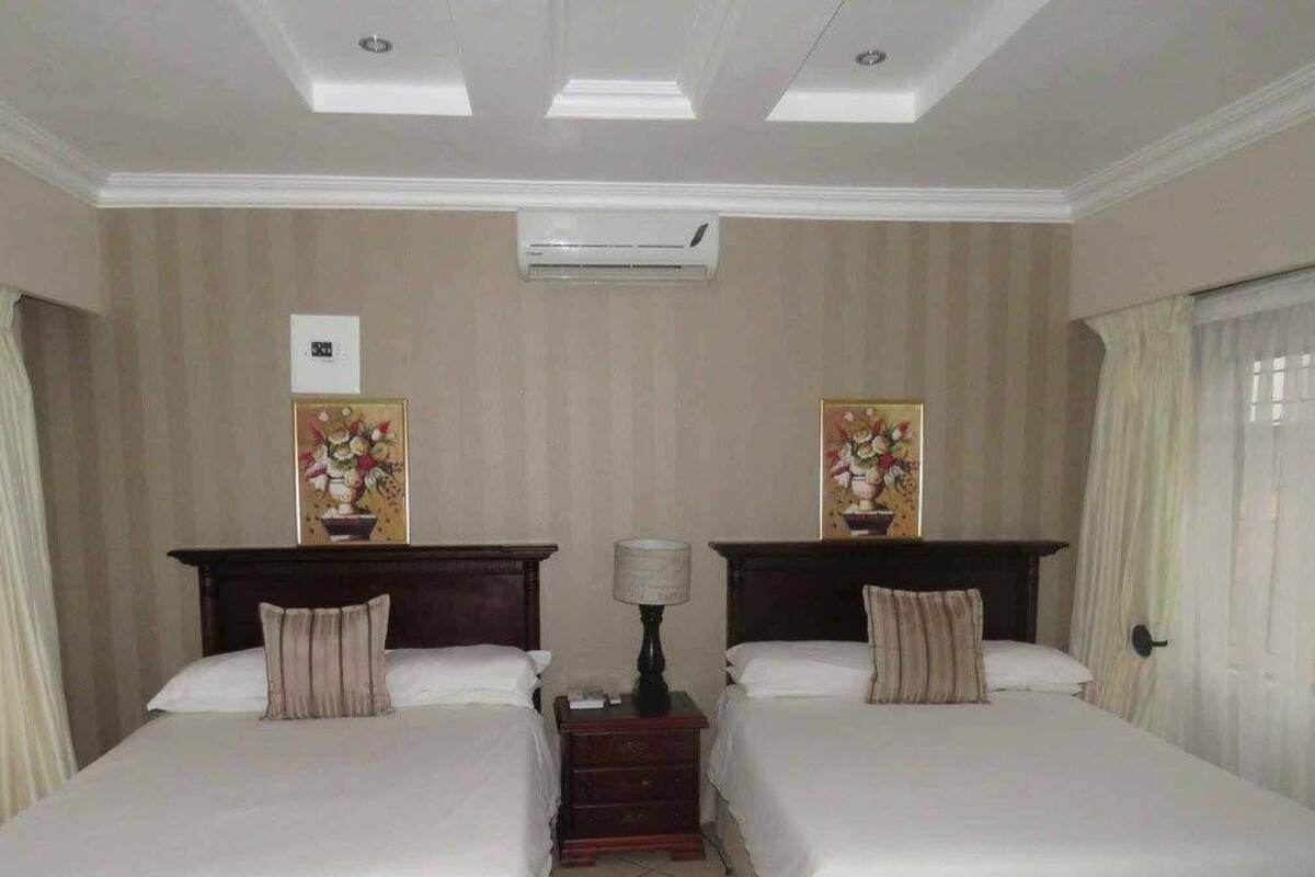 Desk, iron/ironing board, bed sheets
