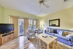 Flat-screen TV, DVD player, books