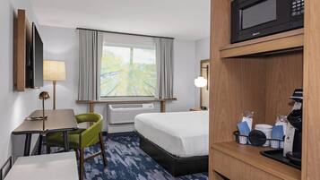 Desk, laptop workspace, blackout drapes, iron/ironing board