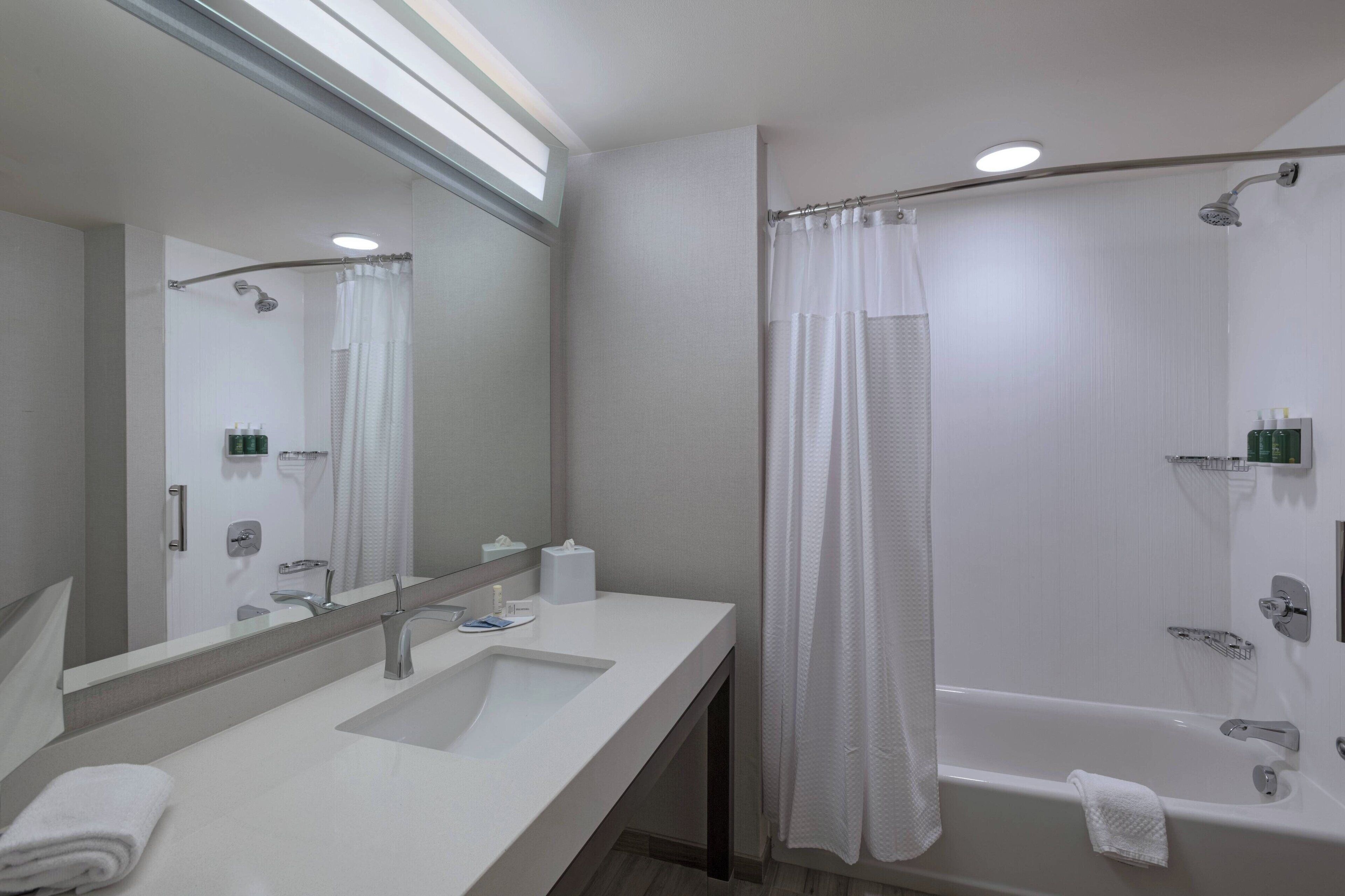 designer toiletries, hair dryer, towels, soap