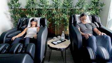 Relax in comfort with two massage chairs and a tranquil atmosphere.