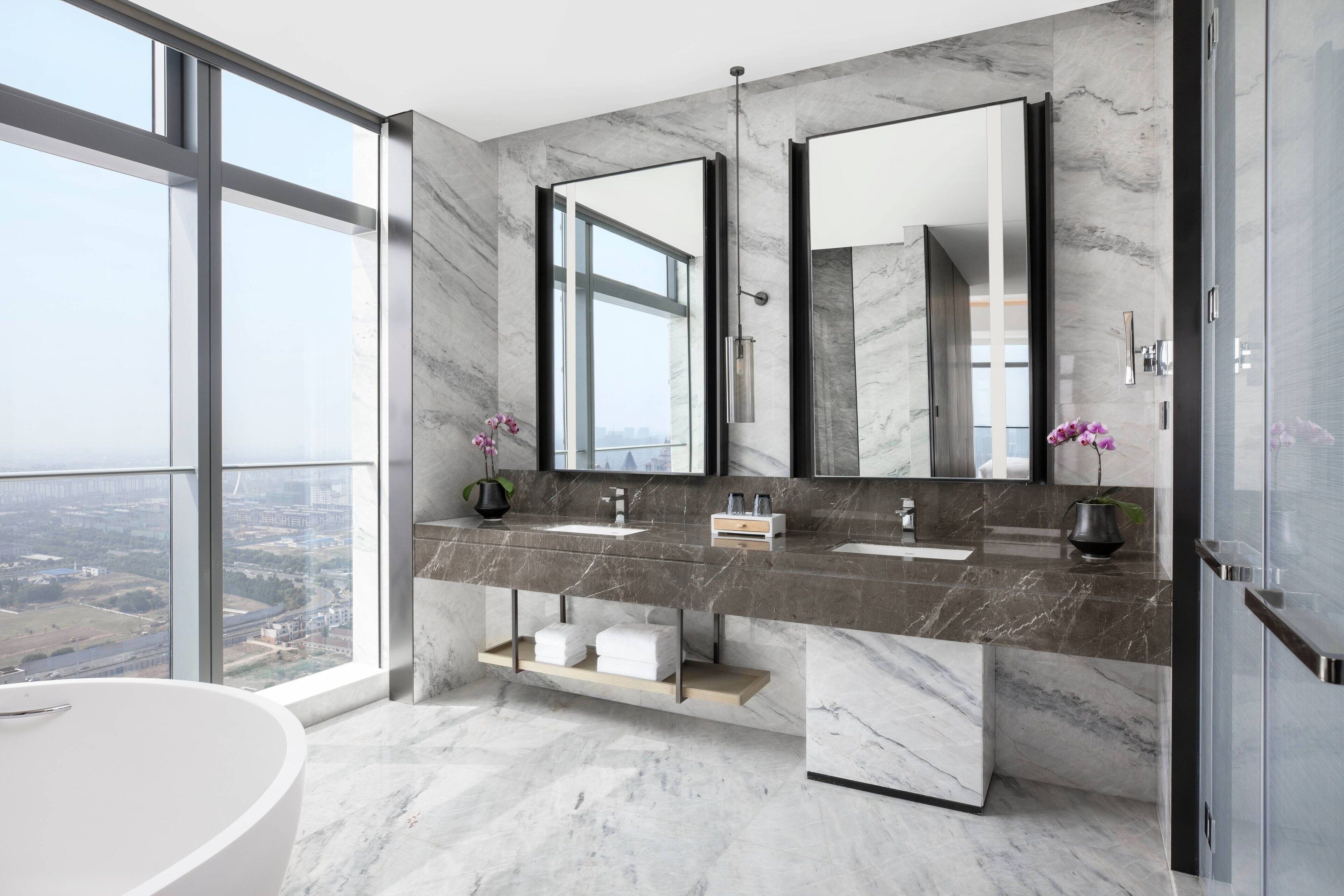 separate bathtub and shower, rainfall showerhead, designer toiletries