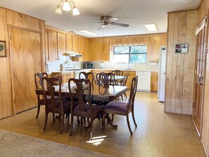 Enjoy cooking and dining in this well-equipped kitchen with a central island, dining area, and modern appliances.