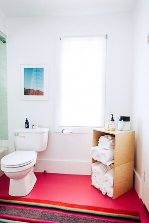 Combined shower/tub, hair dryer, towels, soap