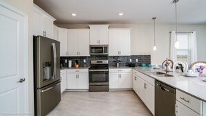 House, Multiple Beds | Private kitchen
