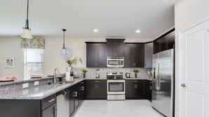 Casa, várias camas | Cozinha privada
