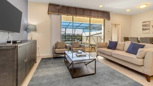 Townhome, 5 Bedrooms | Living area | LCD TV, fireplace, video-game console - Windsor at Westside 8870 (Kissimmee)